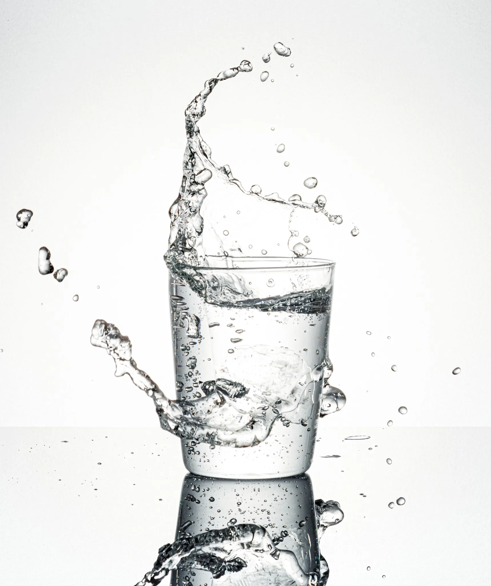 Glass of clear drinking water with a splash